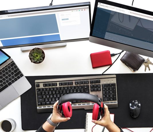 People Working on Computer PC on White Table